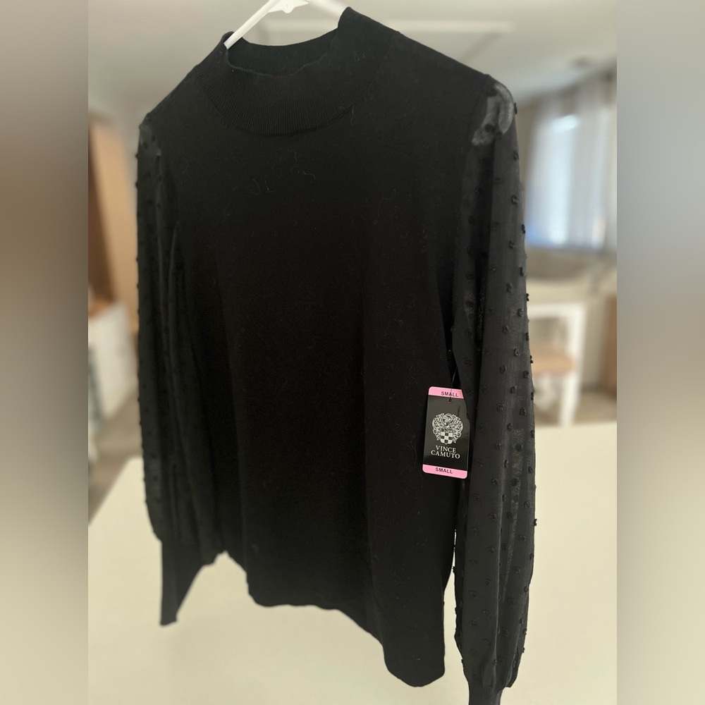 Long sleeve puff see through sleeve. Size small. New with tags.